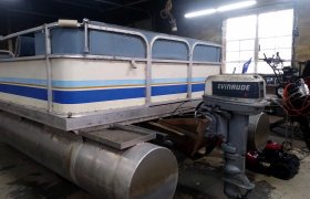 Flooring and interior upholsery restoration of an old pontoon performed by Mike's Marine & Small Engine Repair